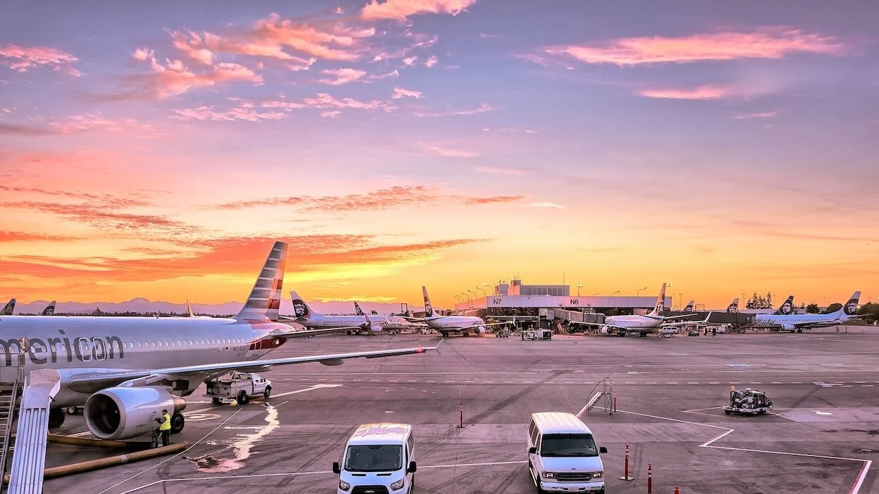 Airport with colourful sunset in background