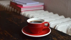 stock image of cup of hot drink next to a radiator