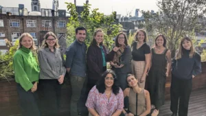 Team members of Opportunity Green on an outside balcony