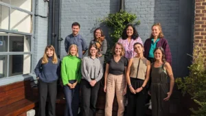 People in a group outside posing for a picture