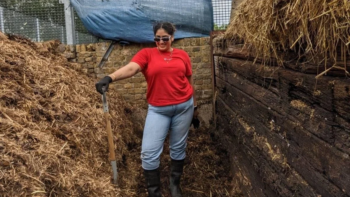 Sabrina stood in a haystack with shovel