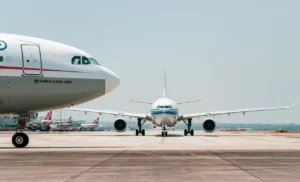 Image of two airplanes on a runway.