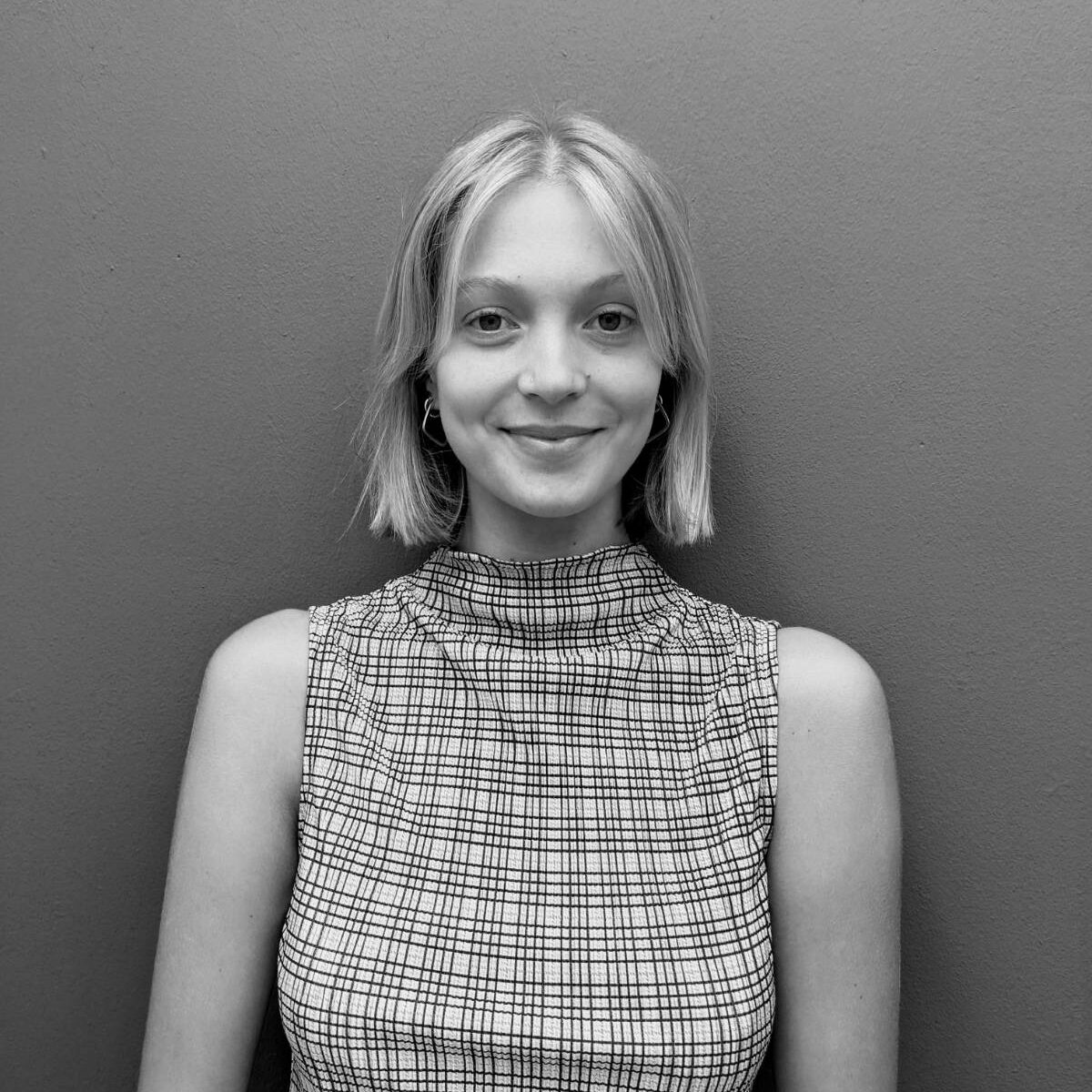 Black and white image of Olivia Moyle, Legal Officer at Opportunity Green.