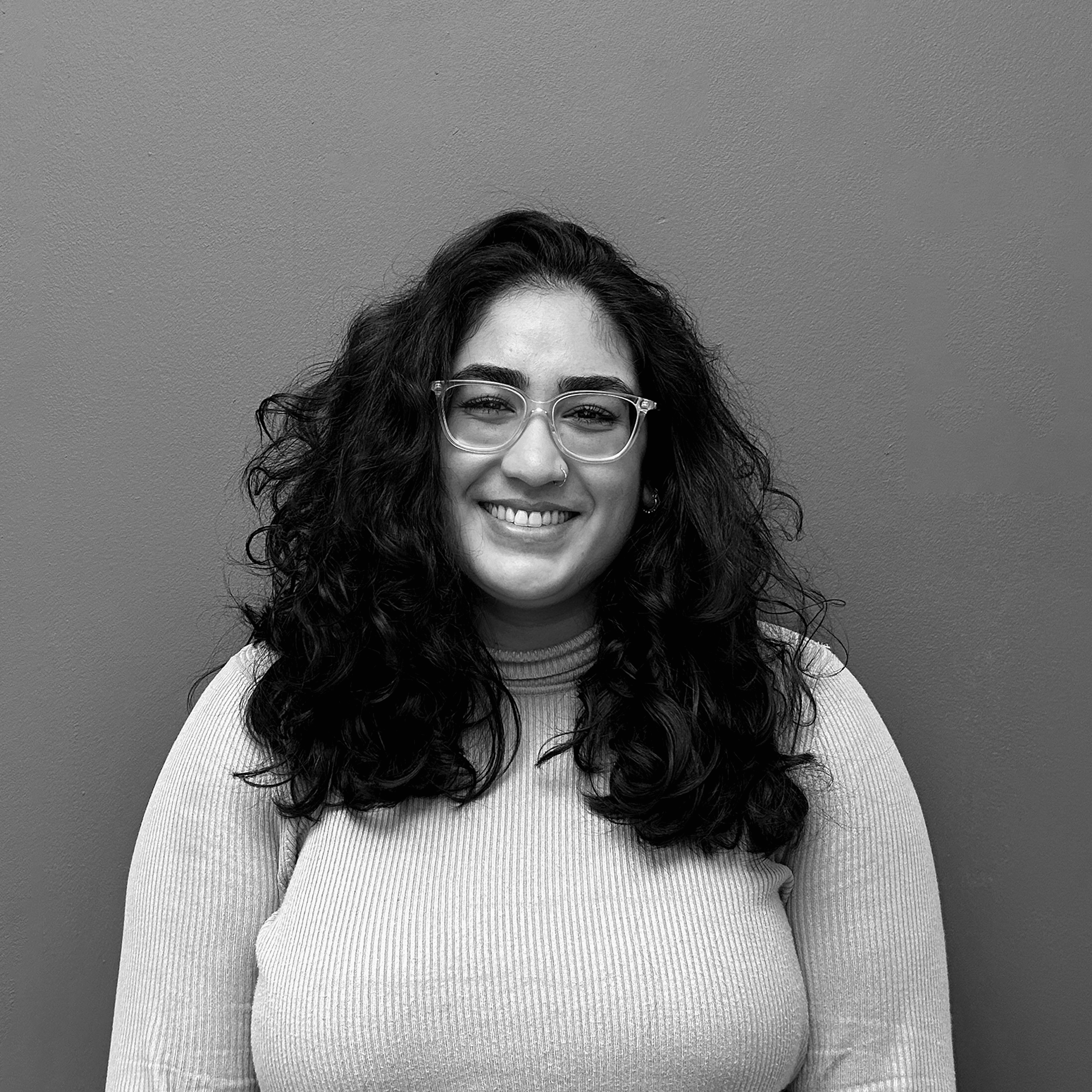 Black and white image of Sabrina Khan-Dighe, Membership & Advocacy Officer at Opportunity Green.