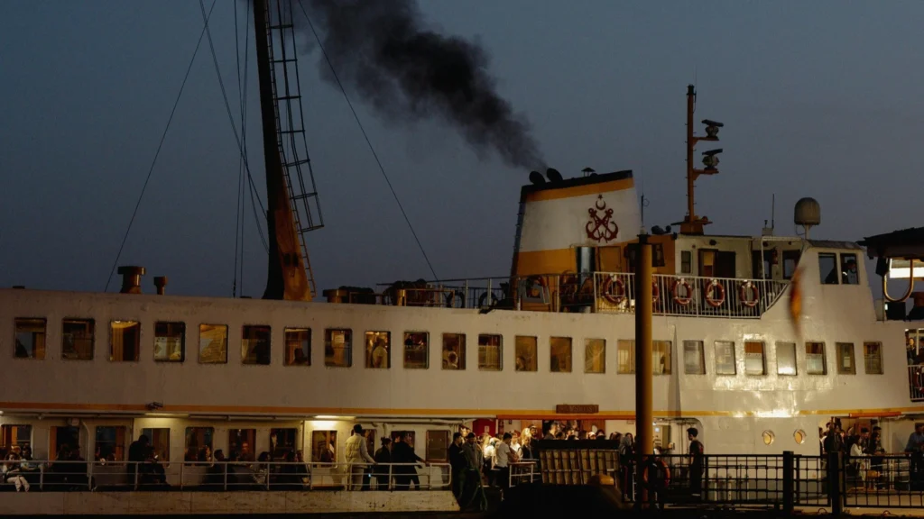 Close up of large cruise ship emitting waste from and polluting with LNG