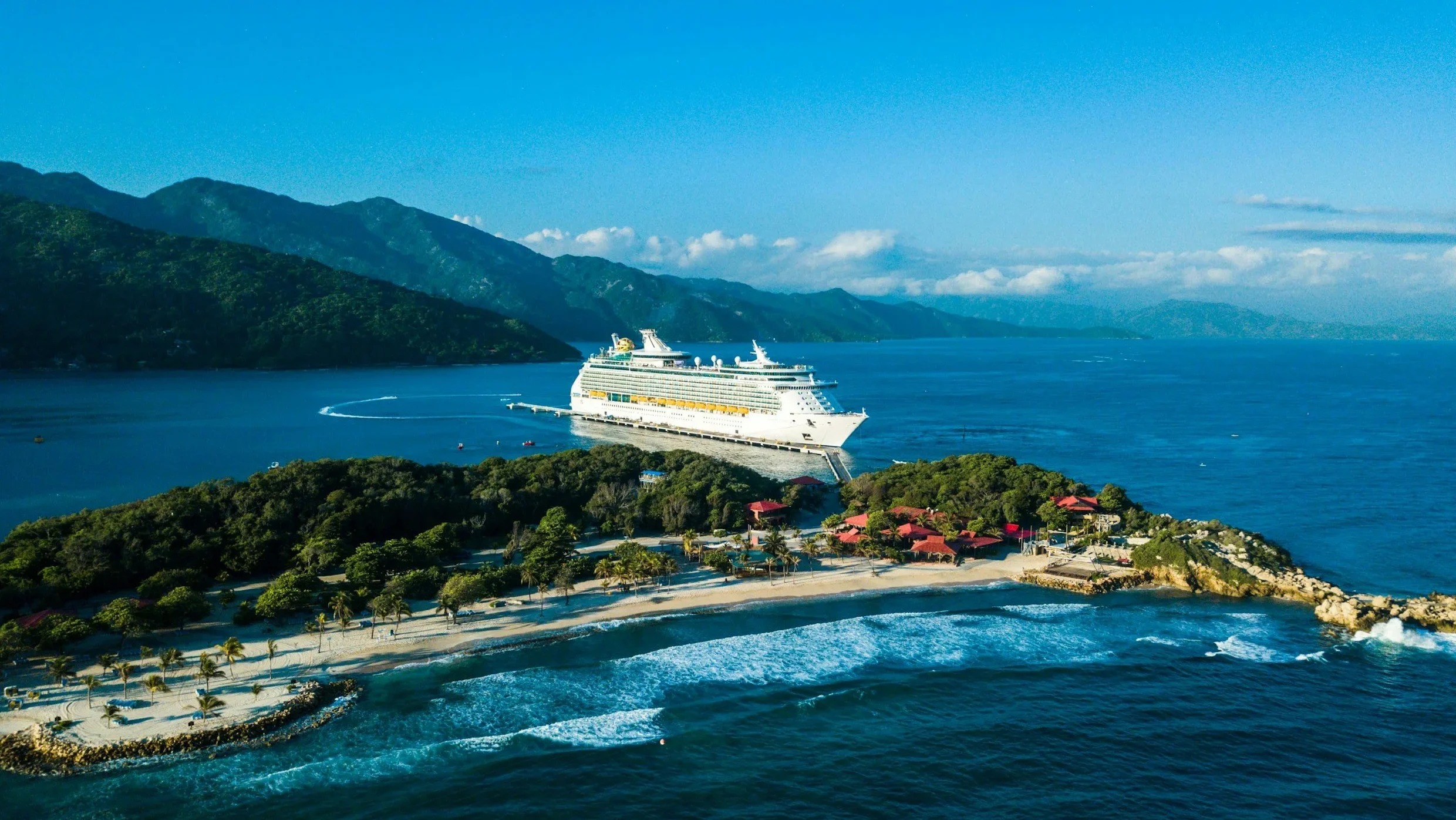 Cruise ship alongside remote island