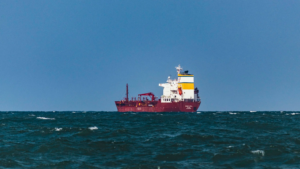 Burgandy red freight ship at sea