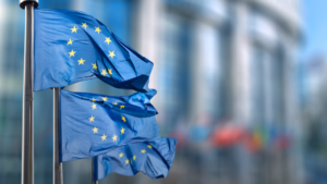A trio of blue and yellow EU flags fluttering in the breeze