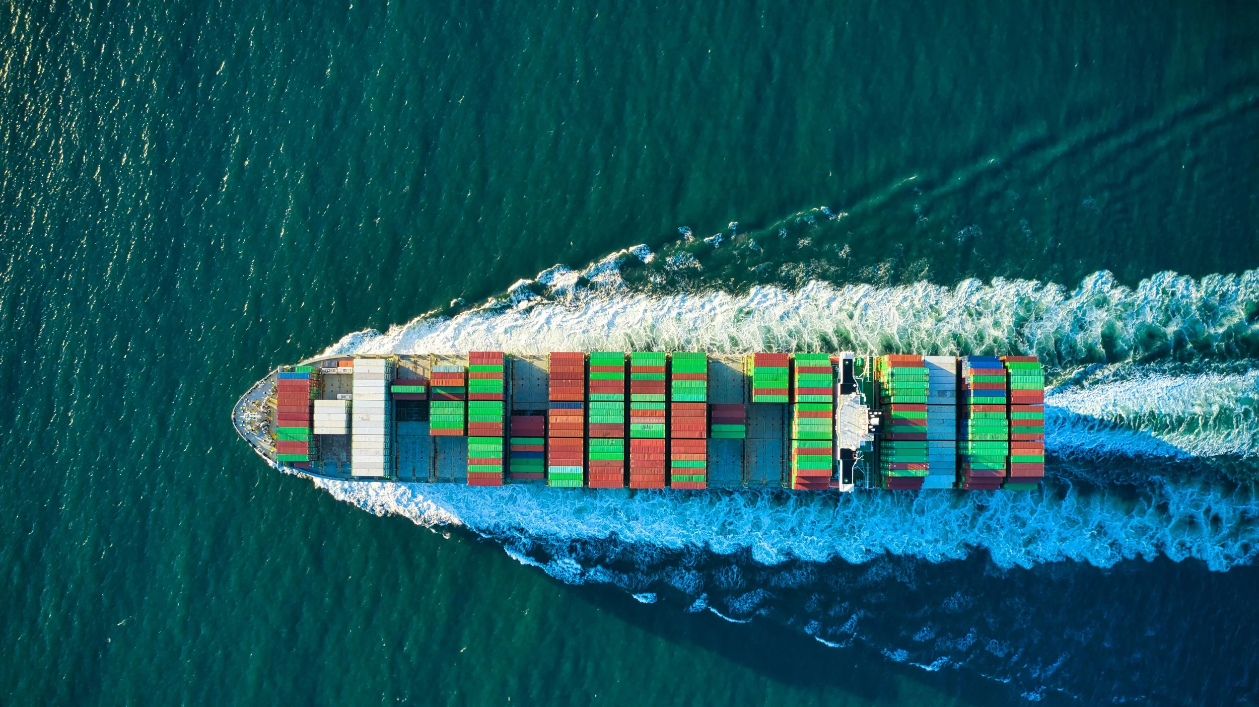 A colourful freight ship in the sea