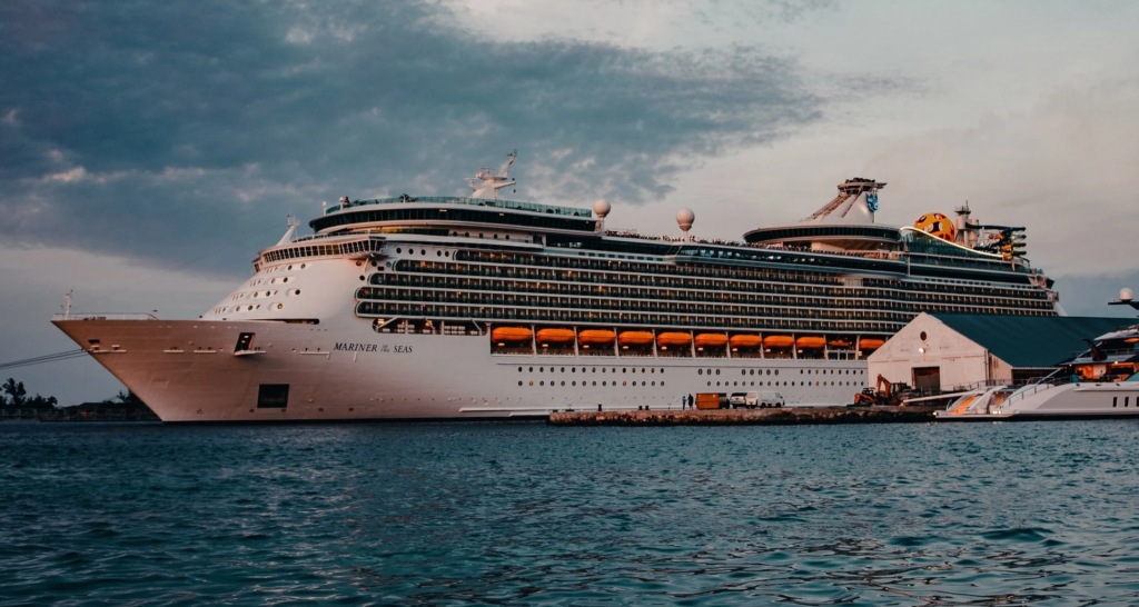 Stock photo of a very large ship called 'Mariner of the Seas' sailing on the sea