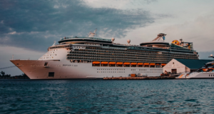 Stock photo of a very large ship called 'Mariner of the Seas' sailing on the sea