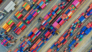 A bird's eye view of multi-coloured cargo boxes at a port