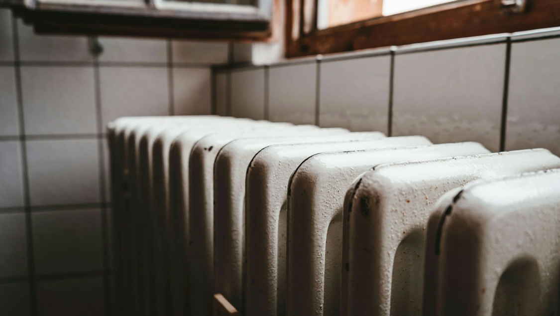 Close-up of a white radiator in a bathroom