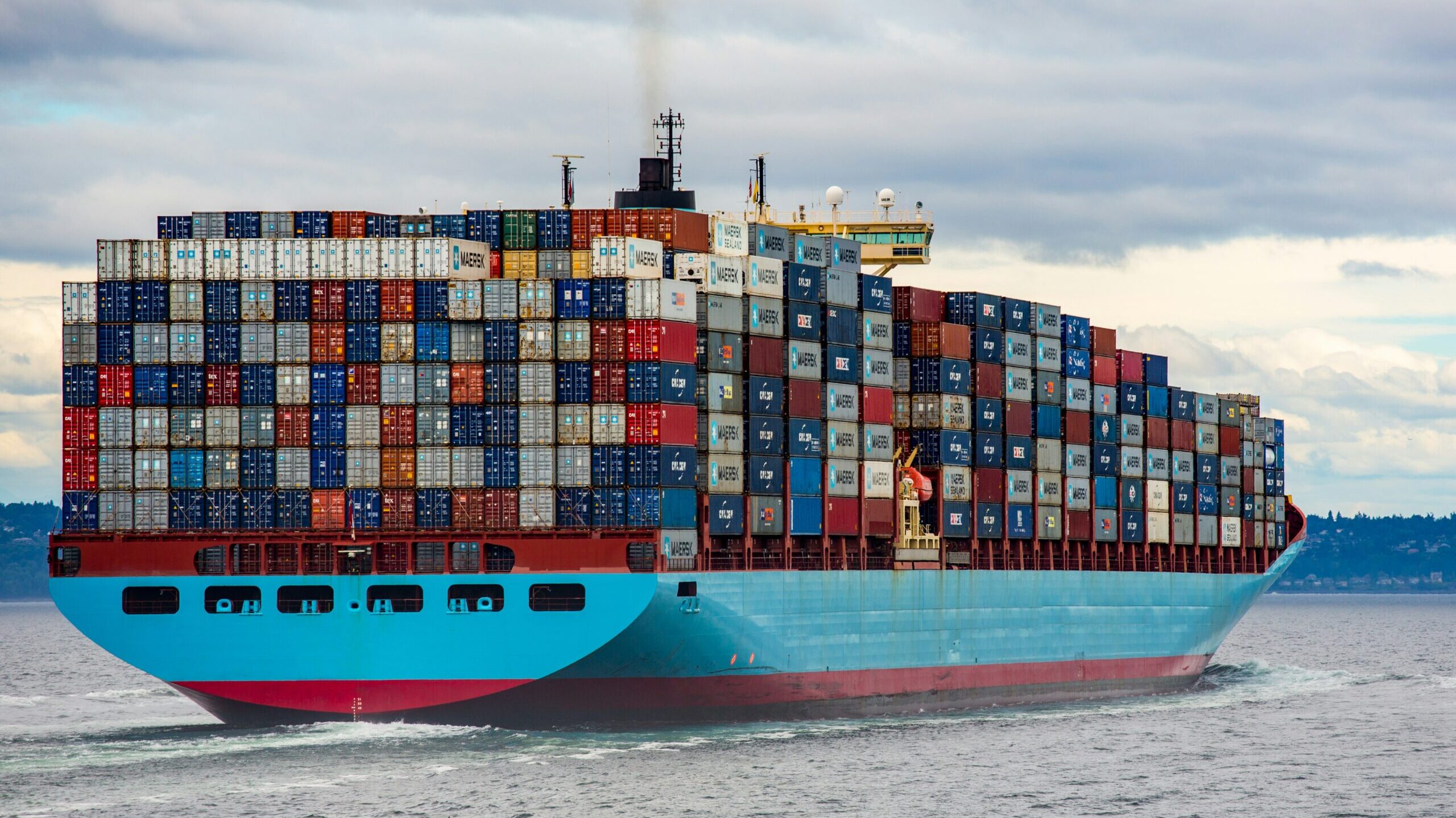 Blue and red cargo ship