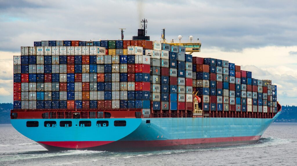 Blue and red cargo ship