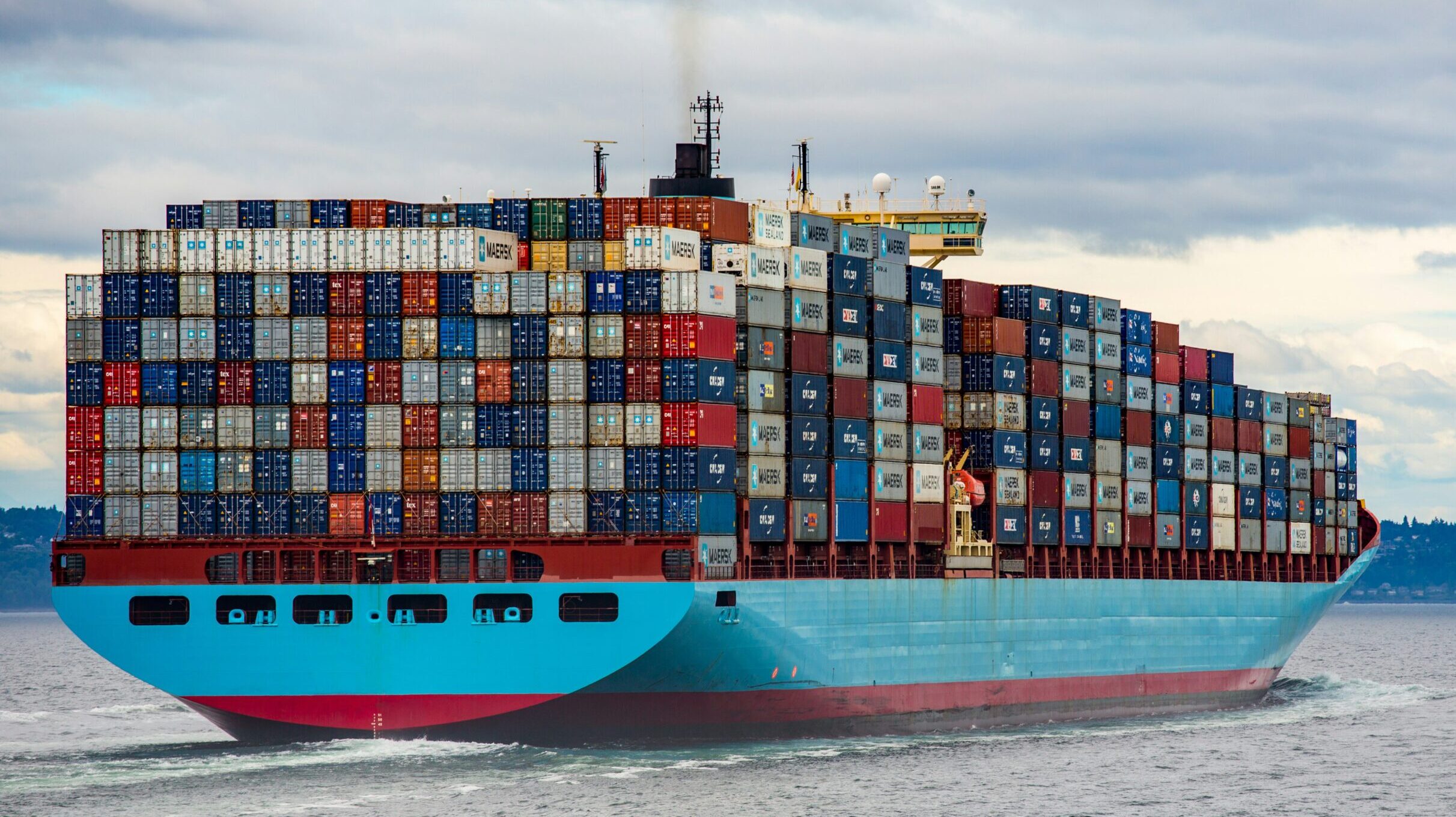 Blue and red cargo ship