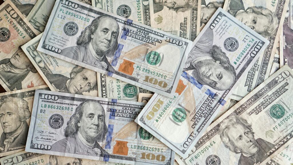 Piles of 100 dollar notes