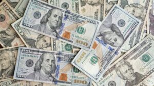 Piles of 100 dollar notes