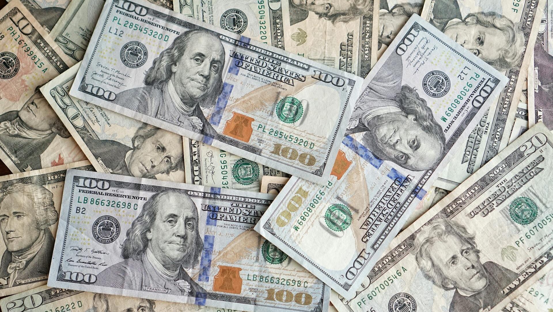 Piles of 100 dollar notes