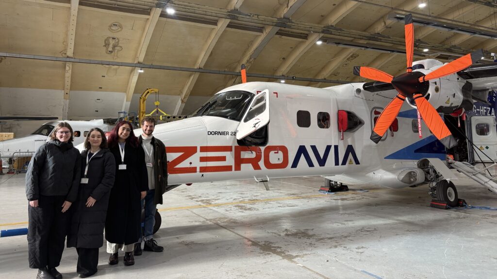 Four members of OG's EU Advocacy team on a site visit to an aircraft hangar to see a Zero-Avia aeroplane